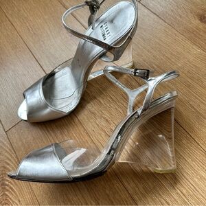 Stuart Weitzman silver wedge heel. Clear heel, great condition size 9.5